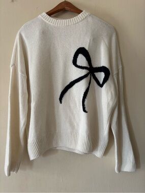 Cream Crewneck Sweater with Black Bow Motif